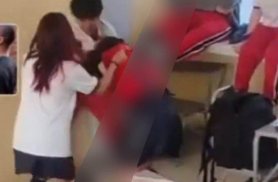 VIDEO: Niña de secundaria recibe golpiza de un compañero en el salón de clases