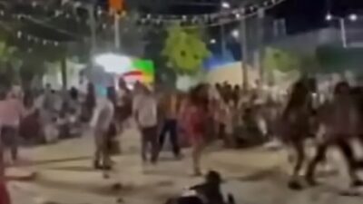VIDEO: Borracho arma pelea durante baile popular y dispara a dos personas